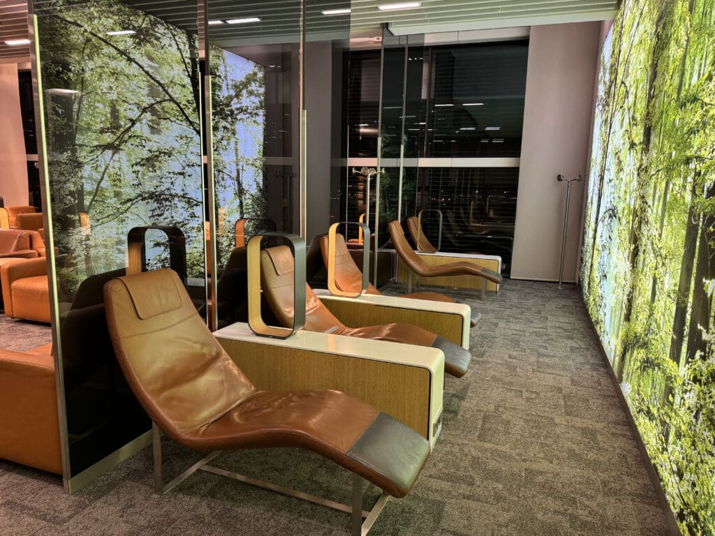 a room with chairs and a window