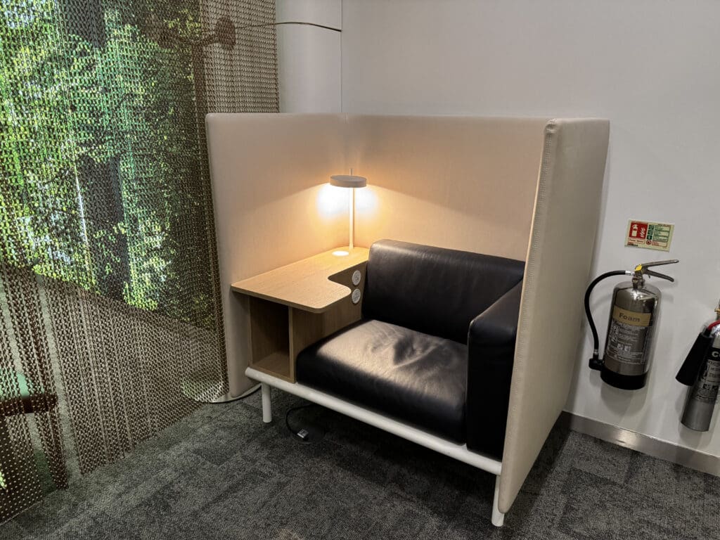 a chair with a lamp in a room