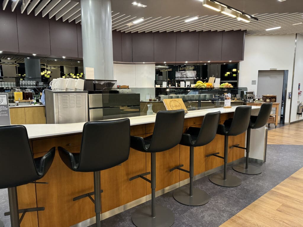 a bar with chairs in a room