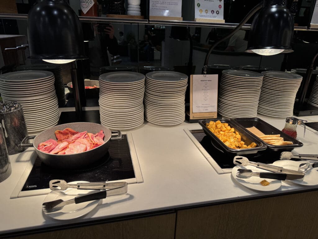 a buffet table with plates and food