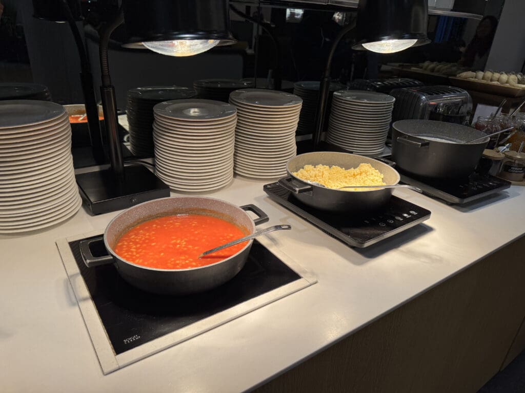 a group of plates and bowls of food on a counter
