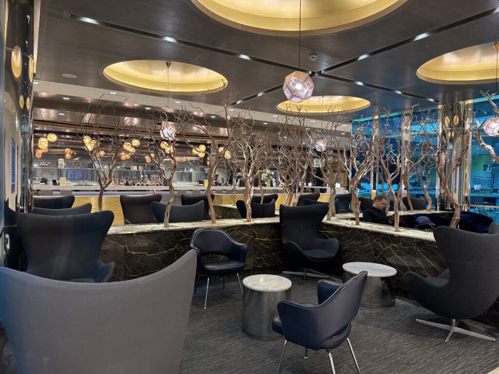 a room with chairs and tables and trees