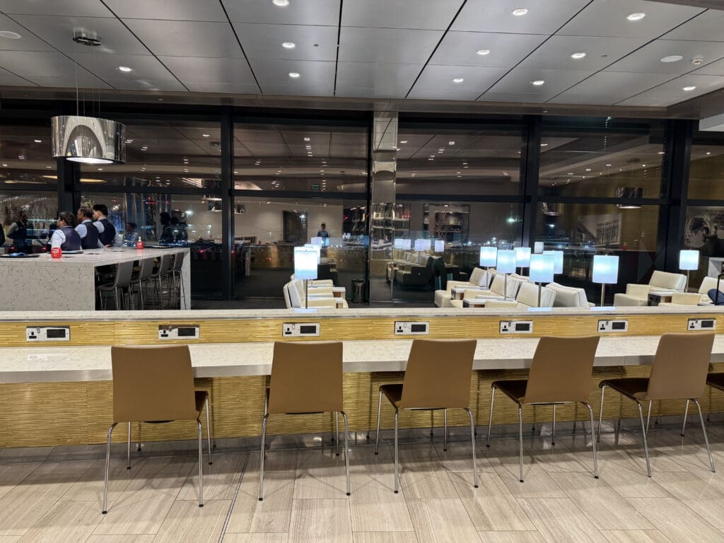 a restaurant with a bar and chairs