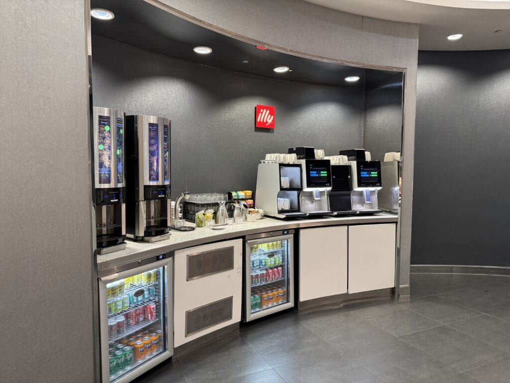 a coffee machine and beverage dispenser in a room