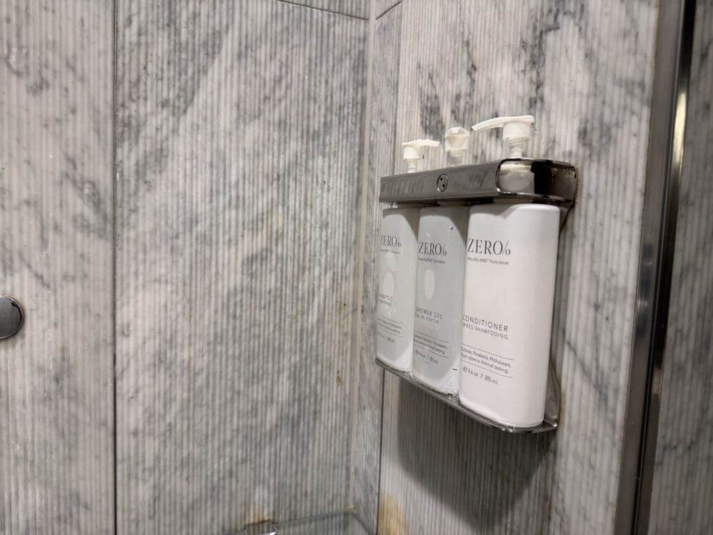 a group of white bottles on a wall