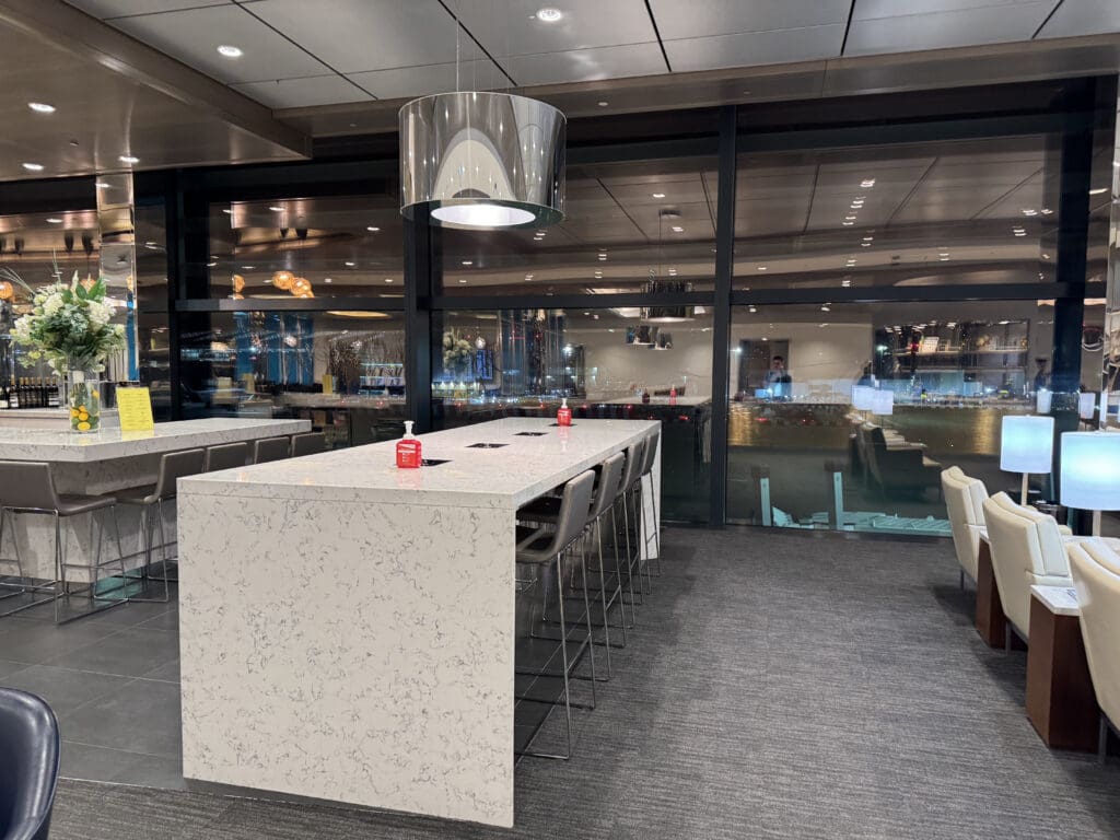 a room with a long table and chairs