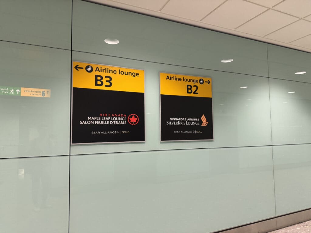 signs on a wall in an airport
