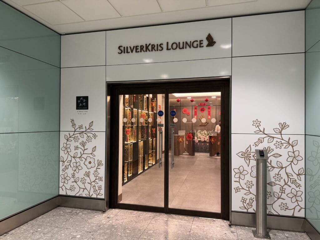 a glass door with a sign on the wall