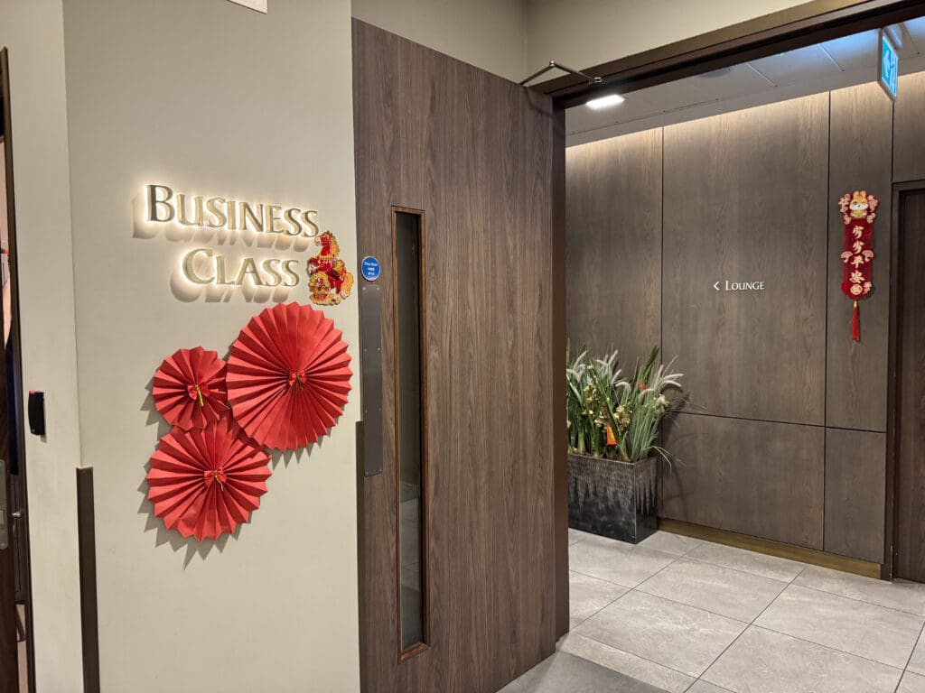 a room with a sign and plants