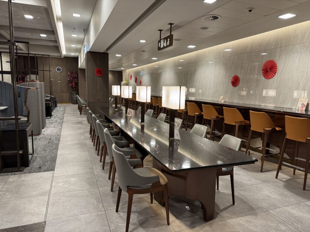 a room with a long table and chairs