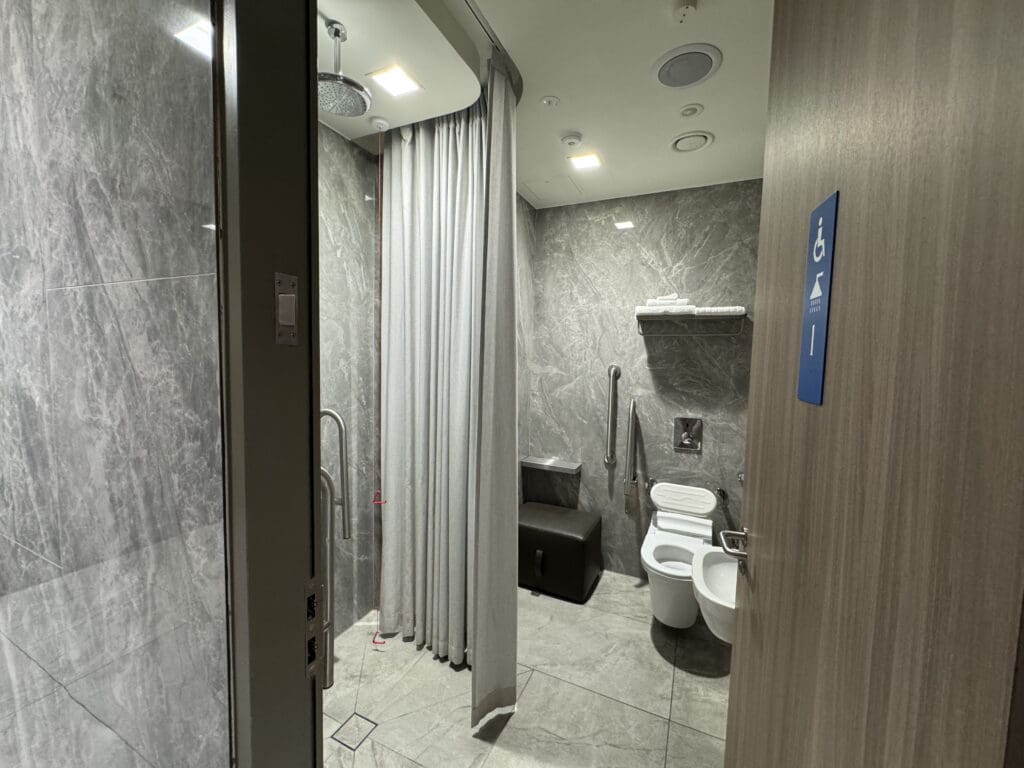 a bathroom with a shower and toilet