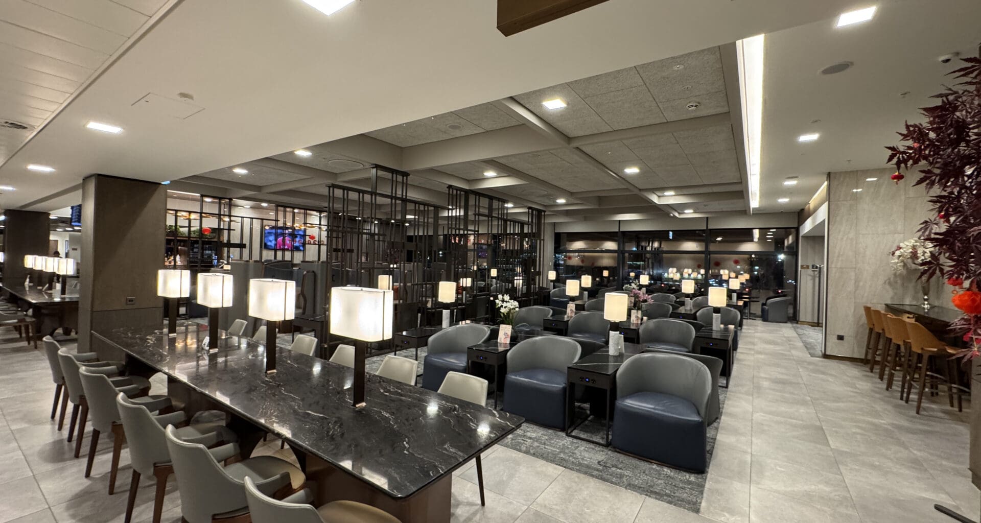 a room with a marble table and chairs