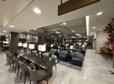 a room with a marble table and chairs