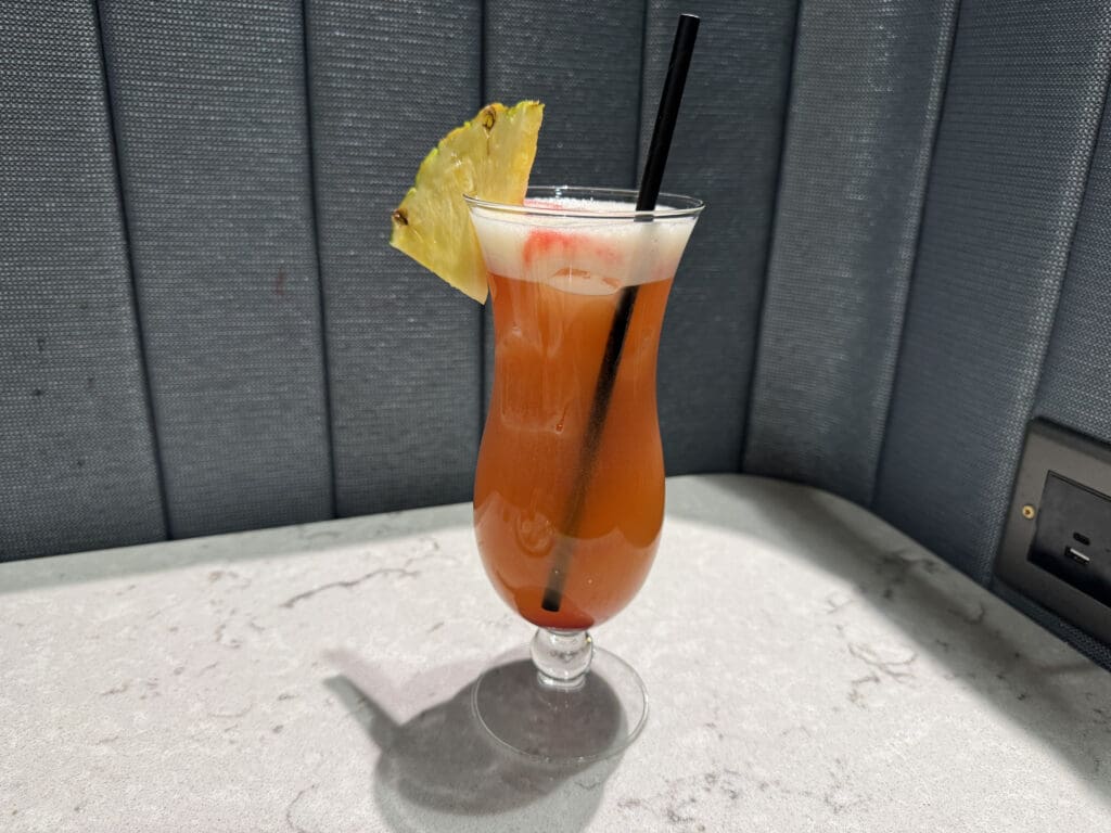 a glass with a drink and a straw