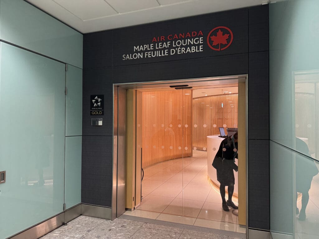 a person taking a picture of a glass door