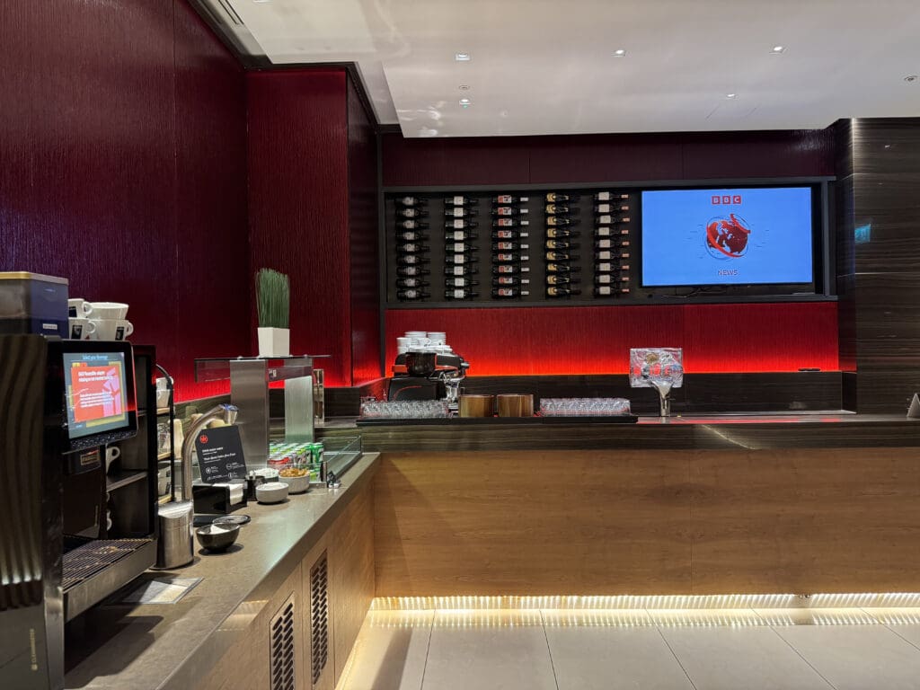 a bar with a tv and a screen