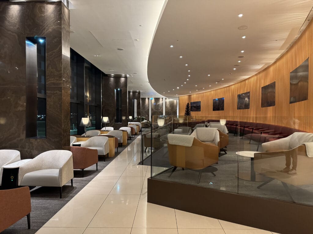 a room with chairs and a glass railing