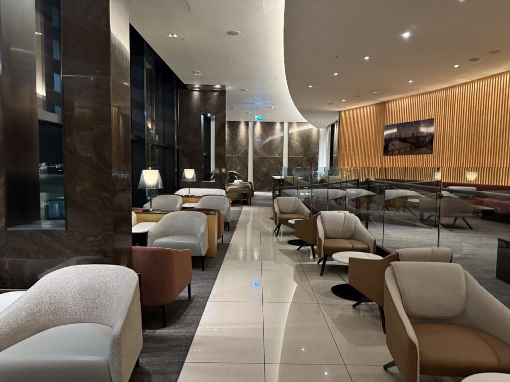 a room with chairs and a glass wall