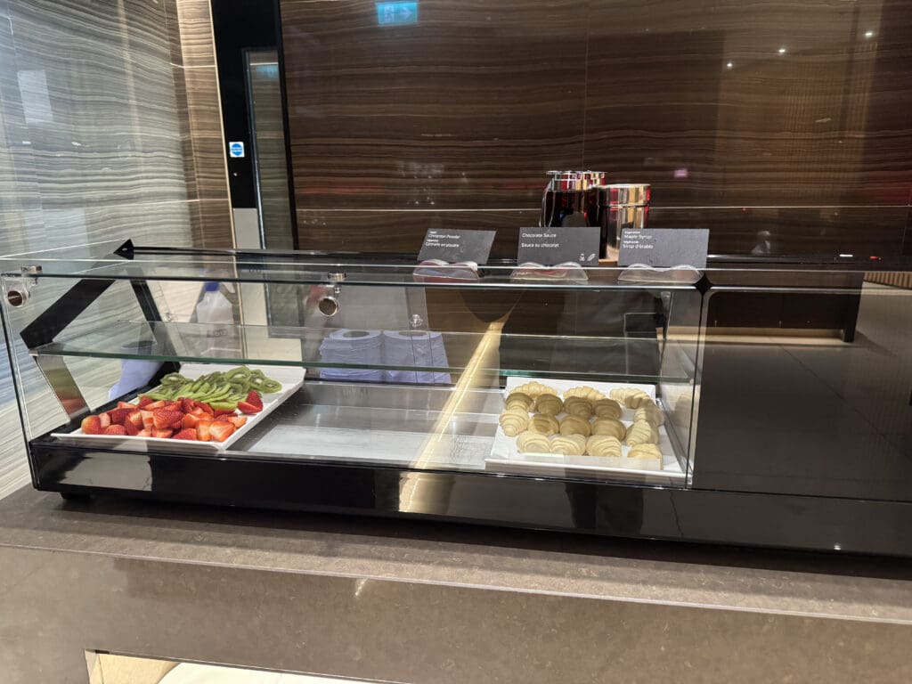 a glass display case with food on it