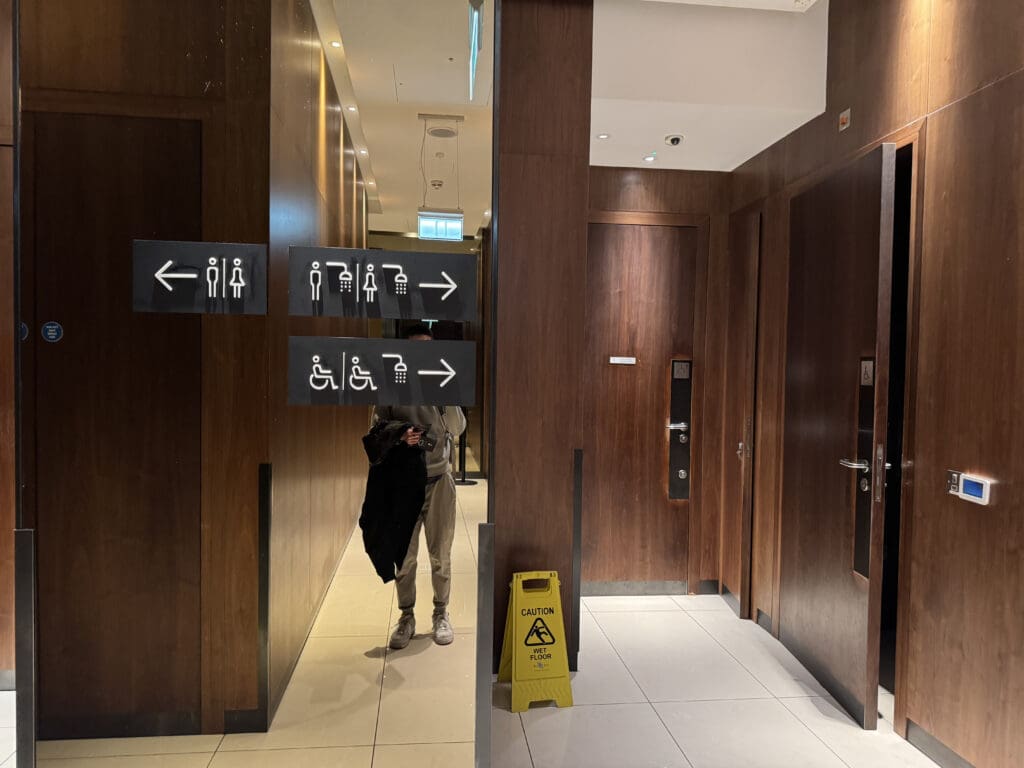 a man standing in a mirror in a building