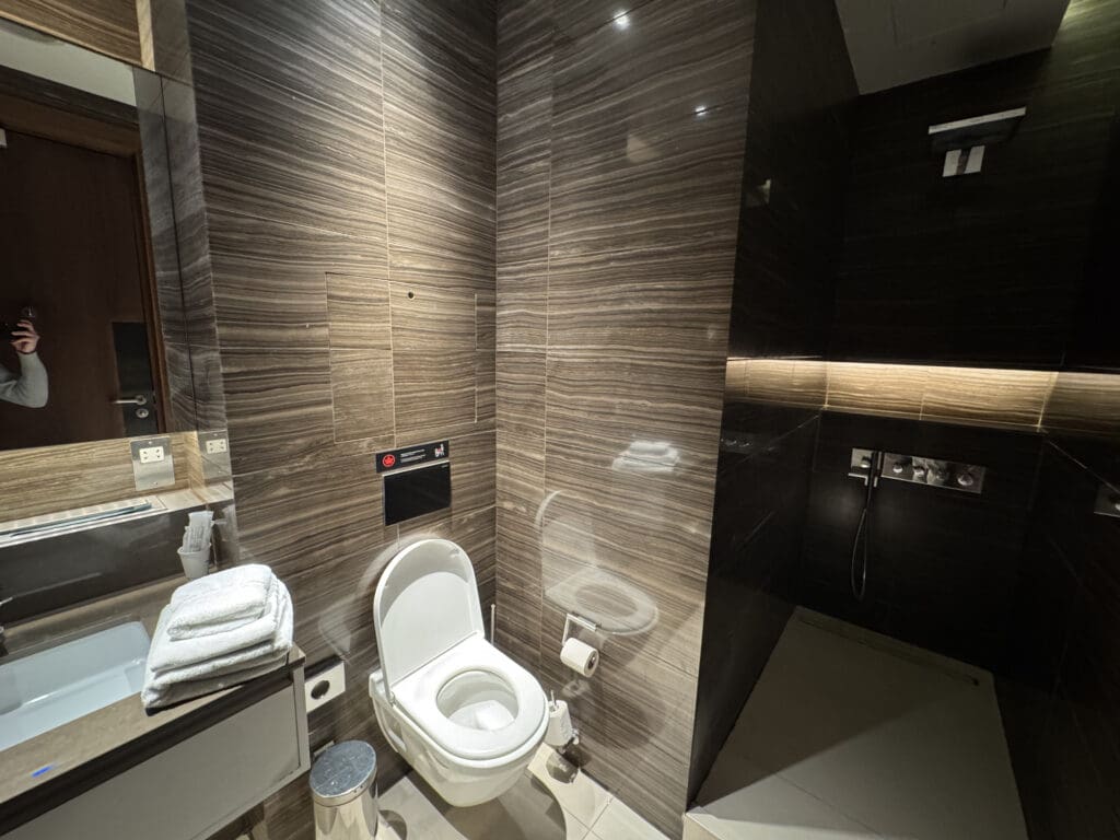 a bathroom with a toilet and shower