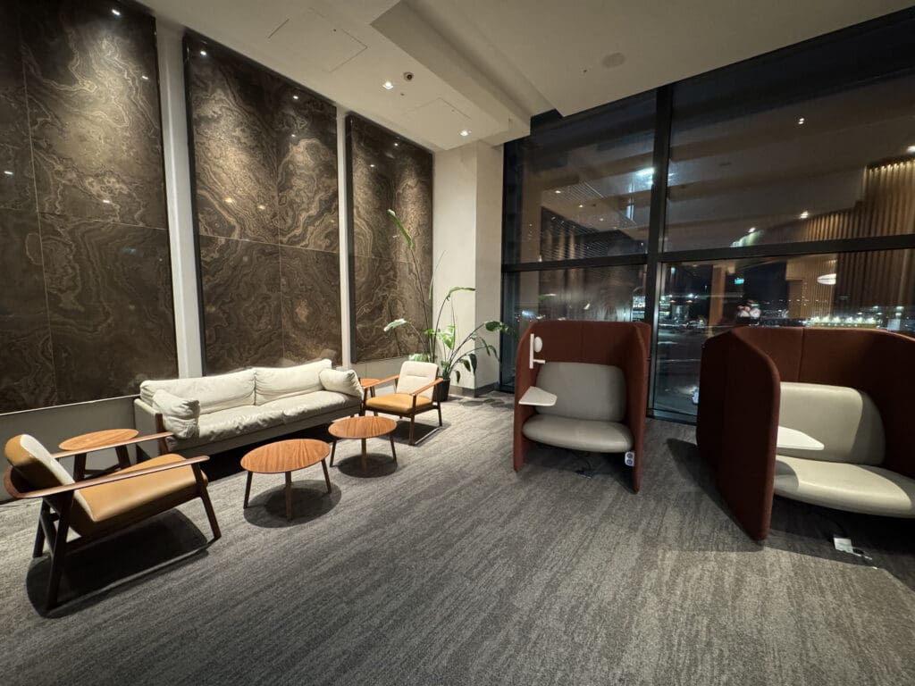 a room with chairs and a large window