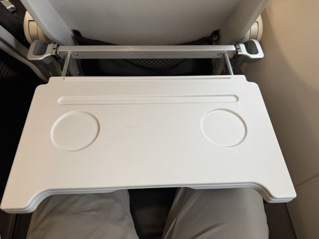 a white tray on a person's lap