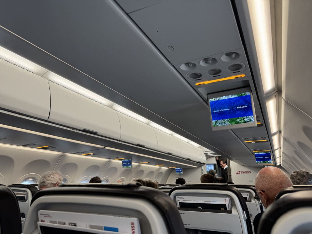 an airplane with people sitting in the seats