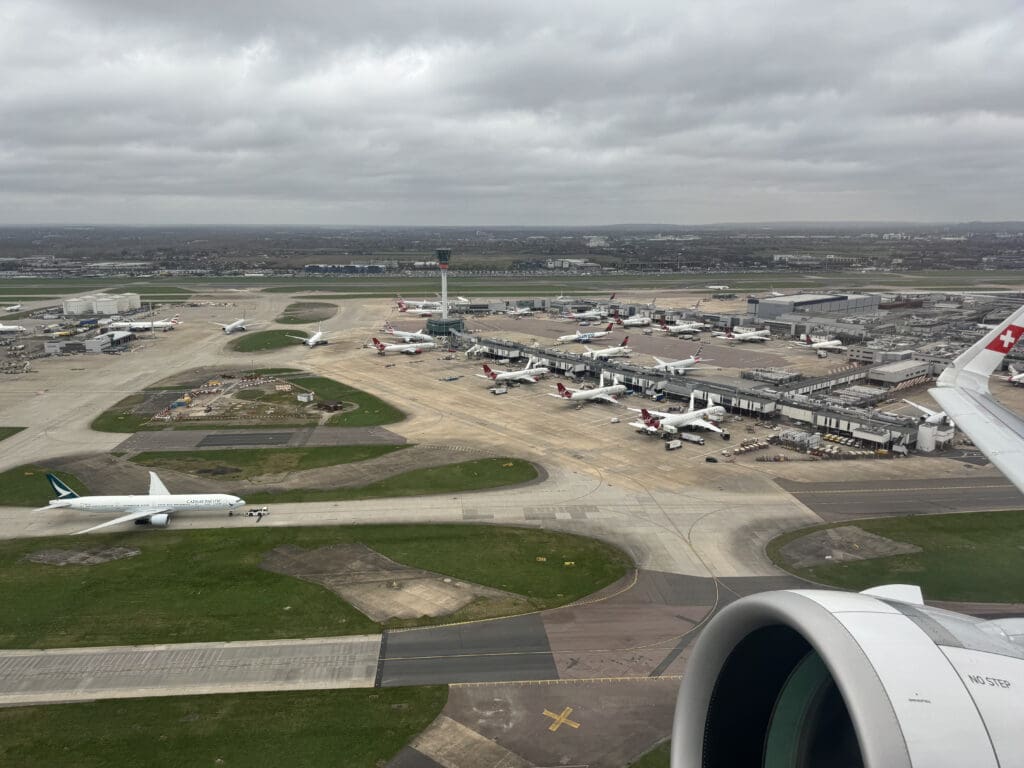 an aerial view of an airport with airplanes