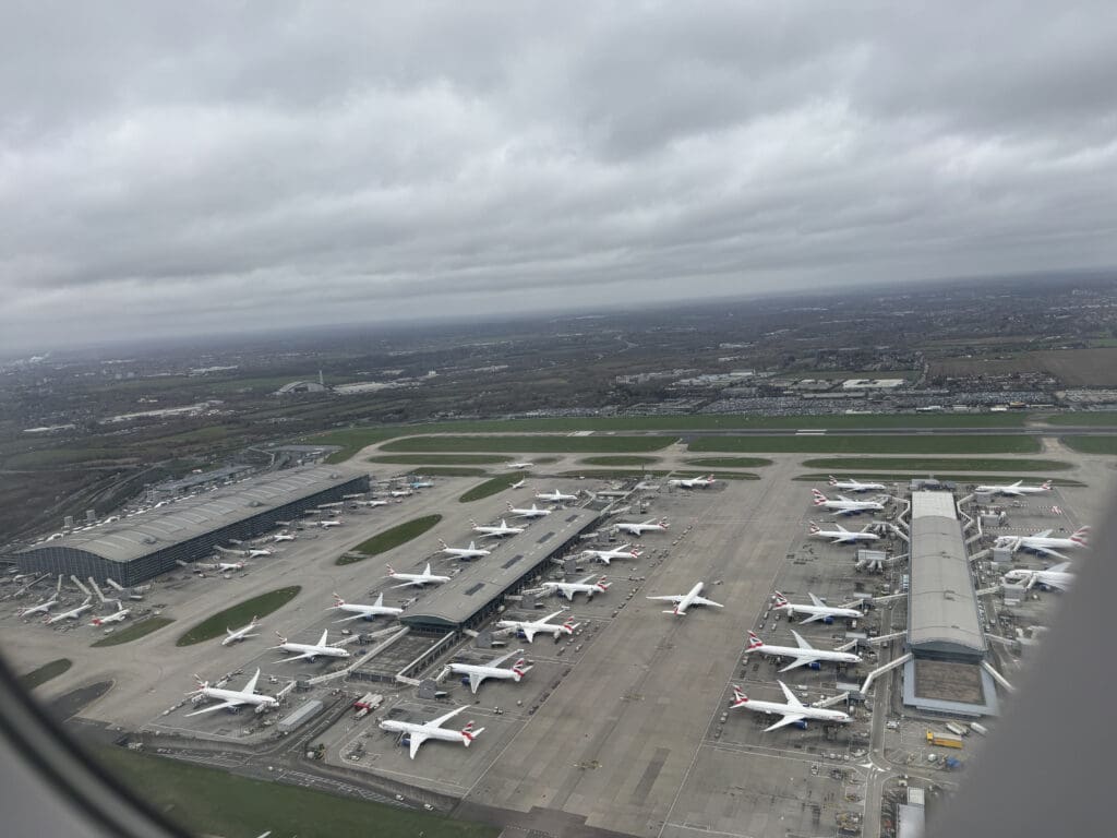 an aerial view of an airport with many airplanes