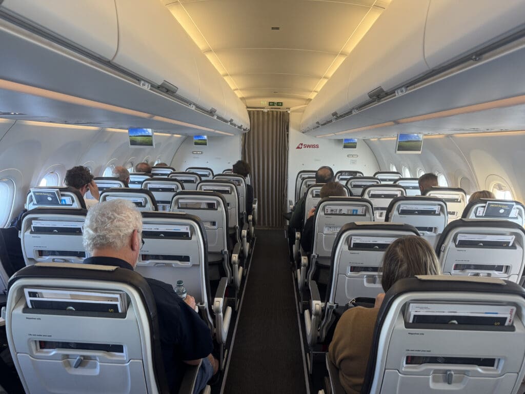 a group of people sitting in an airplane
