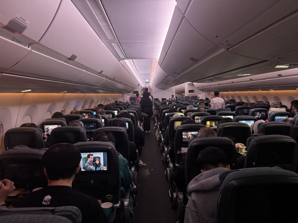 a group of people sitting in an airplane