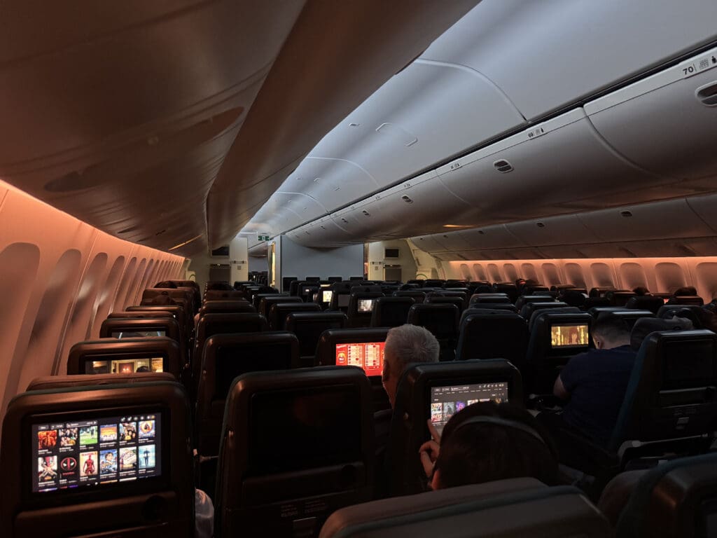 a group of people sitting in an airplane