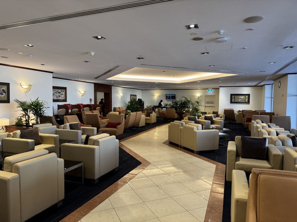 a room with white furniture and chairs