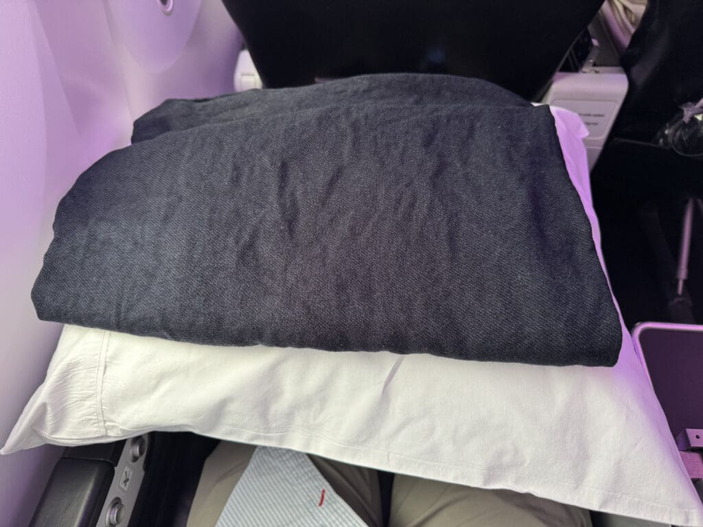 a stack of pillows on a plane