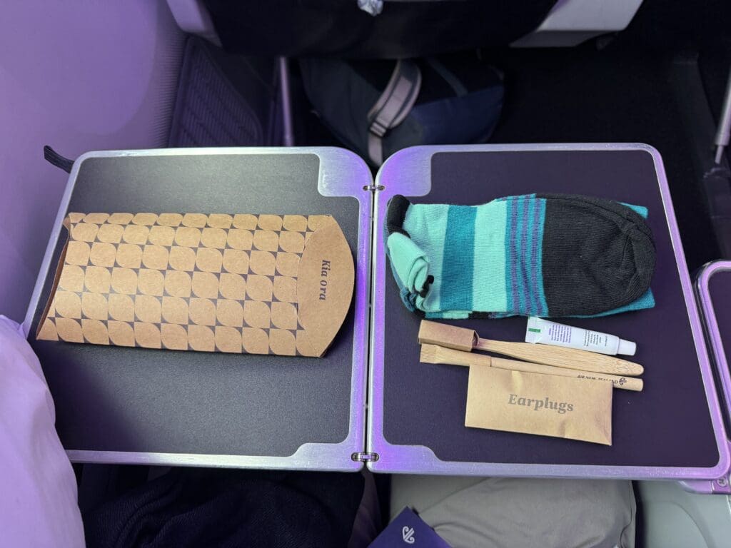 a pair of luggage with a pair of earplugs and a sock