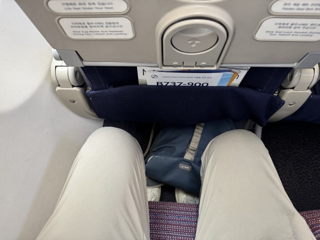 a person's legs in a seat
