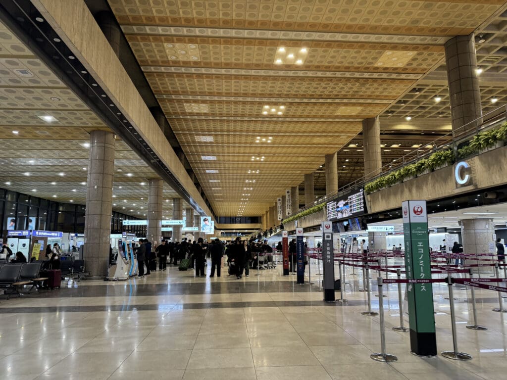 people walking in a large airport