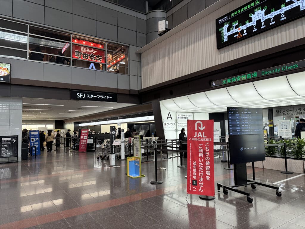 a large airport terminal with people walking around