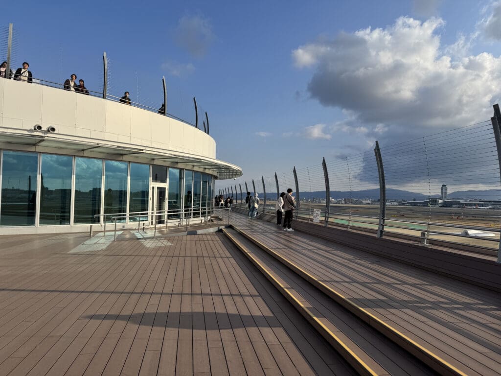a building with a glass wall and a balcony