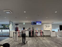 people standing in a line in a building