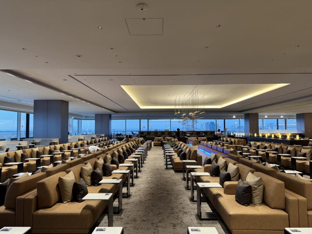 a room with many couches and tables