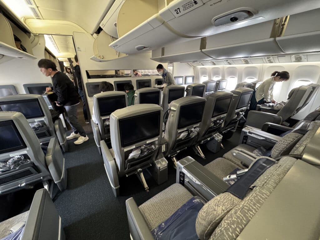 a group of people standing in an airplane