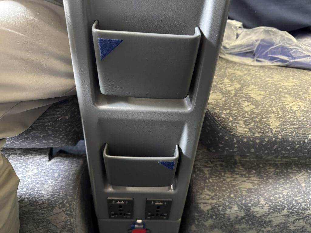 a grey rectangular object with a blue and red strip