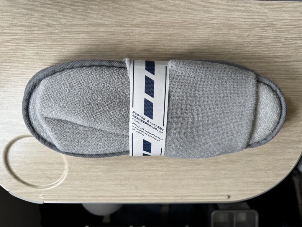 a grey slipper on a table